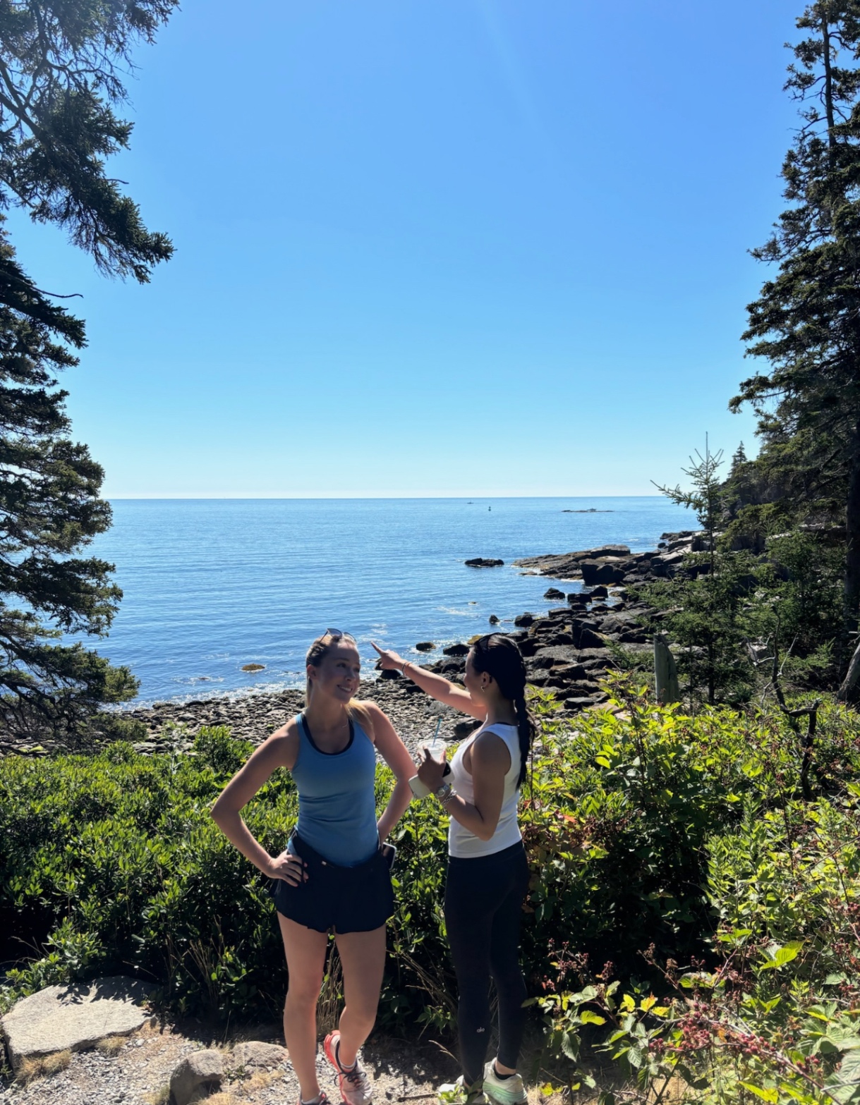 Kaitlyn and Joie hiking on the coast
